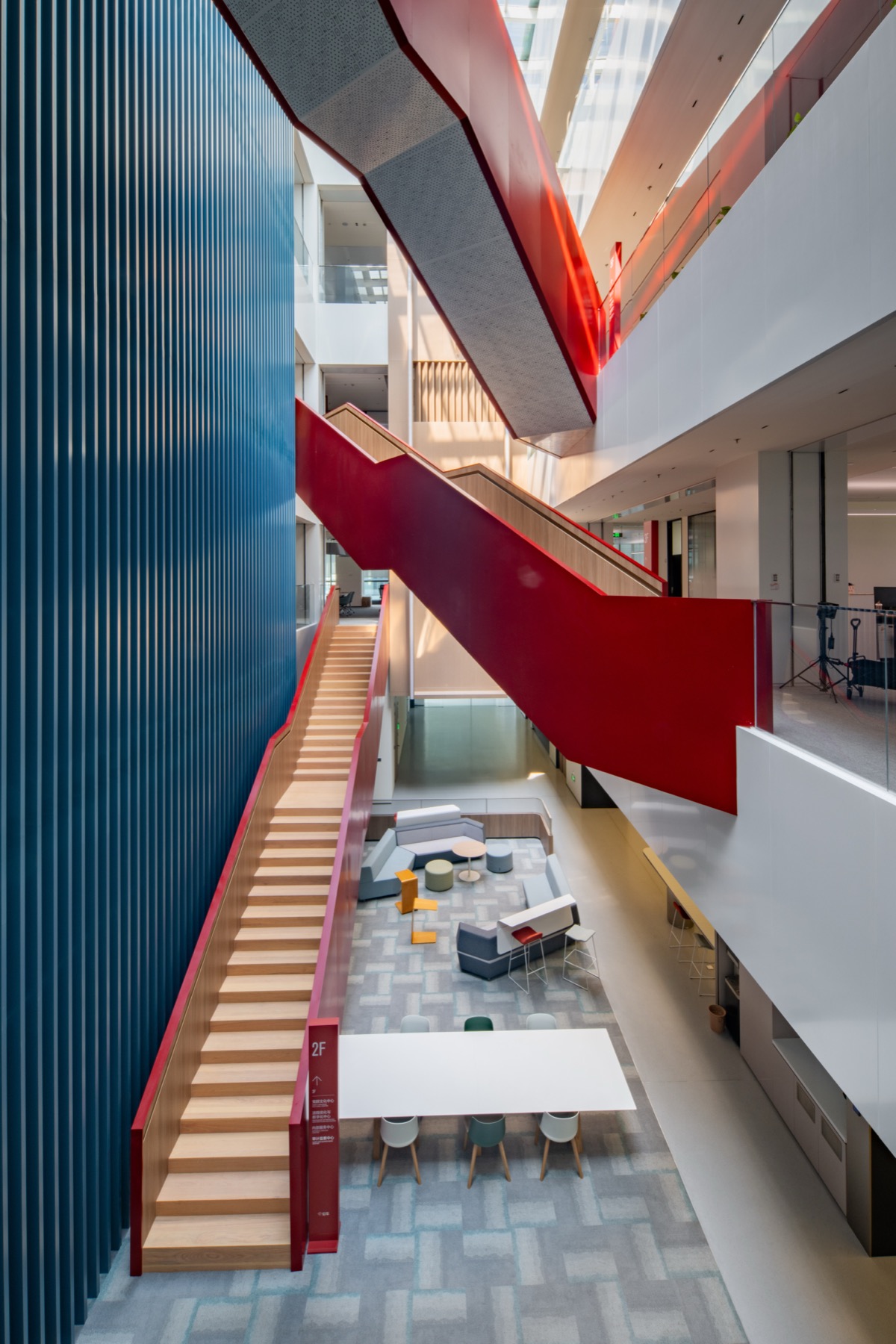 GONEO headquarters interior with red staircase